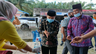Patuhi Protokol Kesehatan, Al Haris dan Nalim Hadiri Pengukuhan Relawan Haris-Sani