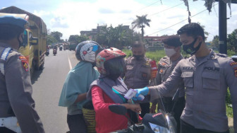 Cegah Penyebaran Covid-19, Polda Jambi Lakukan Imbauan dan Penyemprotan Disinfektan